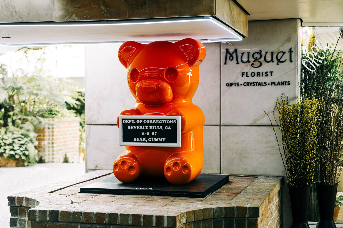 4-foot Orange Vandal Gummy sculpture by WhIsBe
