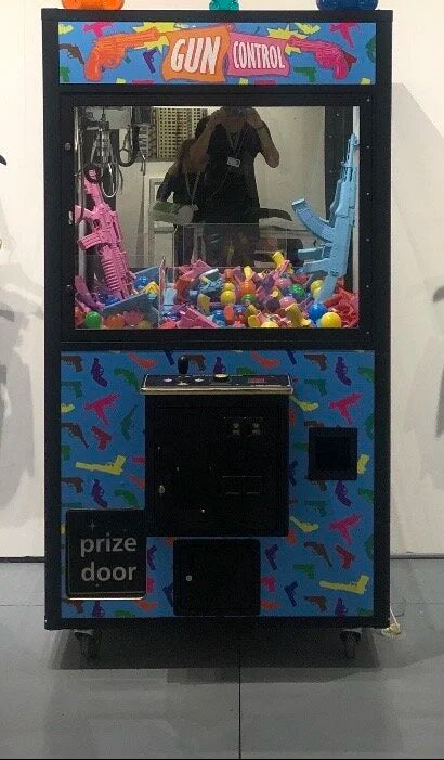 Back to School Shopping claw machine with two 12-inch Vandal Gummy sculptures by WhIsBe